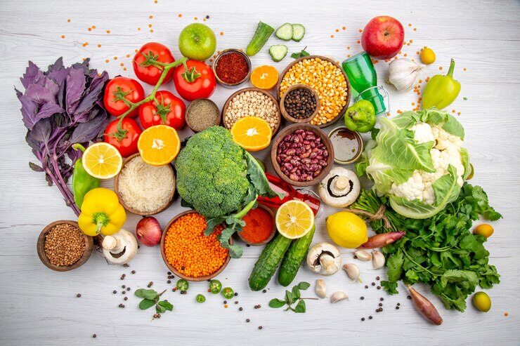 top-view-fresh-foods-spices-vegetables-cooking-white-table_140725-142719